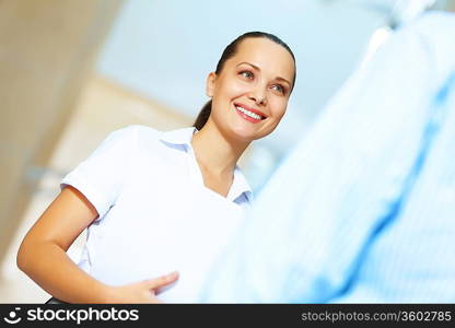 Portrait of happy smiling young businesswoman in office