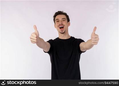 Portrait of happy smiling young man showing thumbs up gesture and looking at camera on isolated over white background. Success concept.