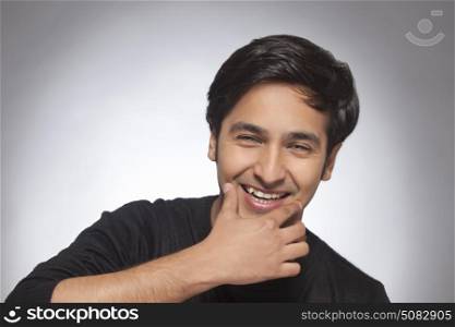 Portrait of happy smiling Young man with smile gesture