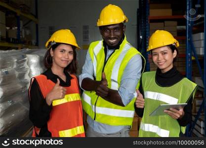 Portrait of happy warehouse worker in the storehouse . Logistics , supply chain and warehouse business concept .. Portrait of happy warehouse worker in the storehouse