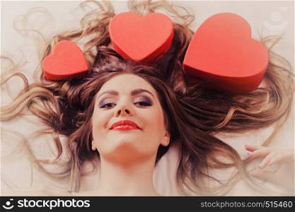 Portrait of happy woman. Attractive young girl with heart shape boxes around head. Valentines day love.. Portrait of happy woman. Valentines day love.