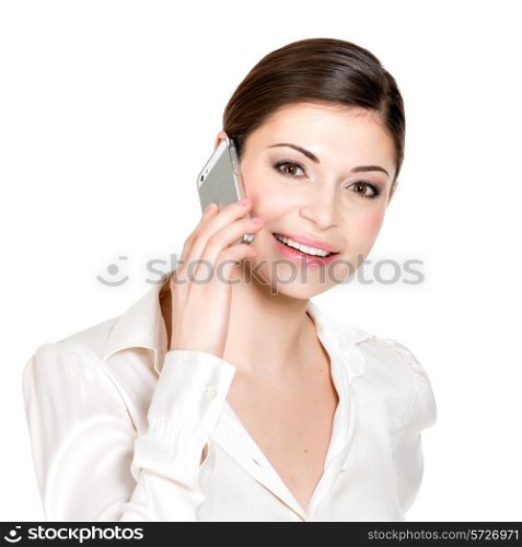 Portrait of happy woman calling by mobile in white shirt - isolated on white. &#xA;