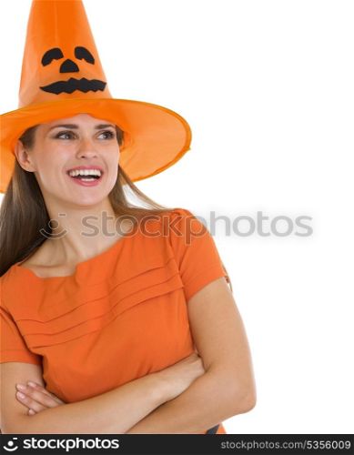 Portrait of happy woman in Halloween hat looking on copy space