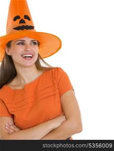 Portrait of happy woman in Halloween hat looking on copy space