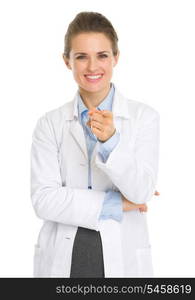 Portrait of happy woman in white robe pointing in camera