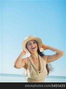 Portrait of happy woman on sea background