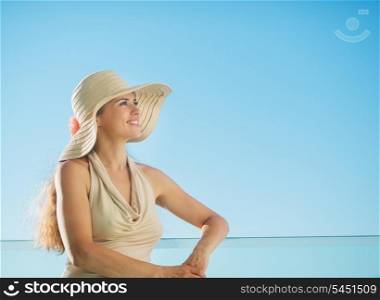 Portrait of happy woman standing on balcony