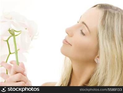 portrait of happy woman with white orchid