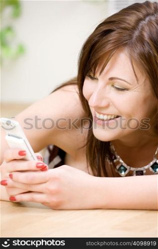 portrait of happy woman with white phone