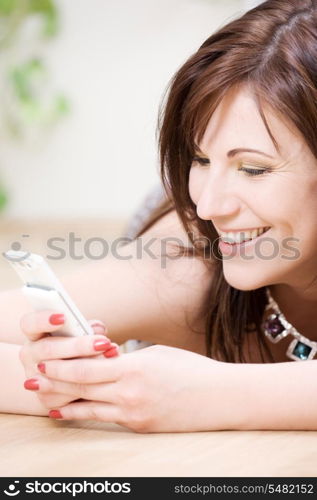 portrait of happy woman with white phone