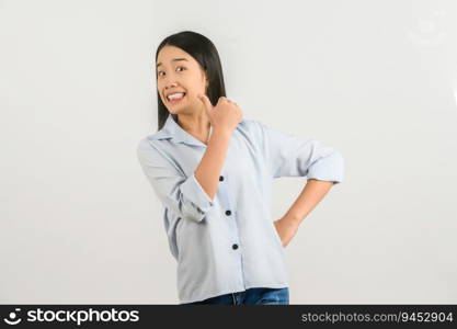Portrait of Happy young asian woman in blue shirt showing thumb up isolated on white background. Expression and lifestyle concept.