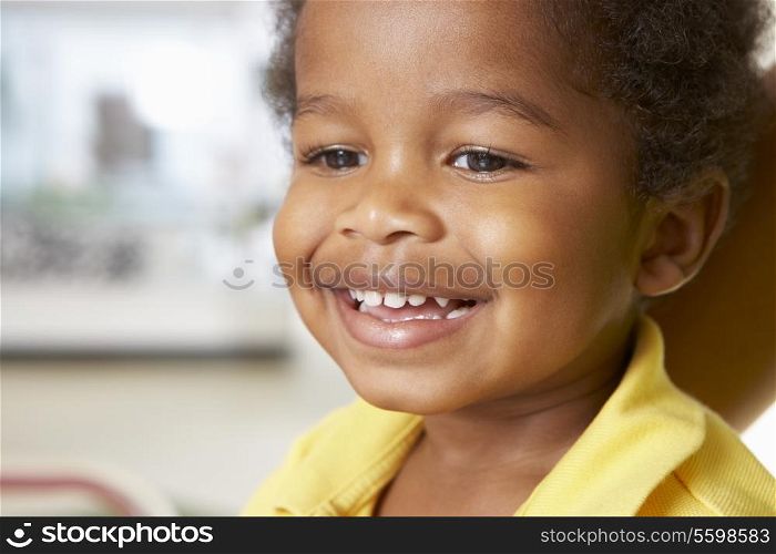 Portrait Of Happy Young Boy At Home