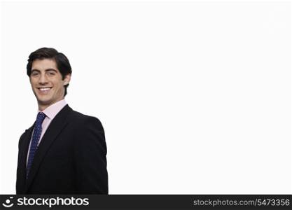 Portrait of happy young businessman against white background