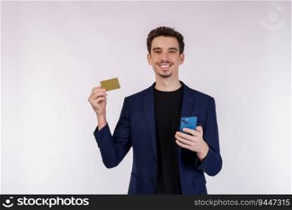 Portrait of happy young businessman standing using mobile cell phone and holding credit bank card isolated on white color background studio. Achievement career wealth concept.