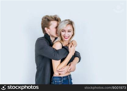 Portrait of happy young couple in studio