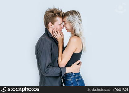 Portrait of happy young couple love together in studio