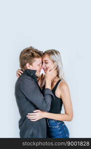 Portrait of happy young couple love together in studio