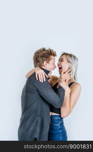 Portrait of happy young couple love together in studio