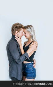 Portrait of happy young couple love together in studio