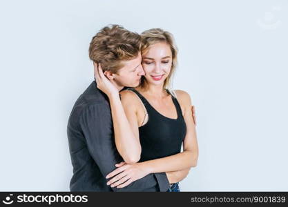 Portrait of happy young couple love together in studio