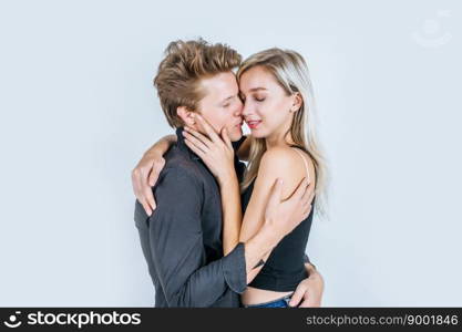 Portrait of happy young couple love together in studio