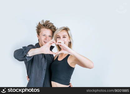 Portrait of happy young couple love together in studio