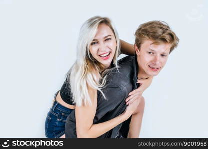 Portrait of happy young couple love together in studio