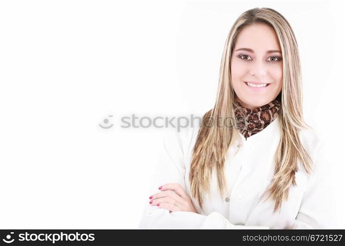 Portrait of happy young doctor woman standing with arms crossed.