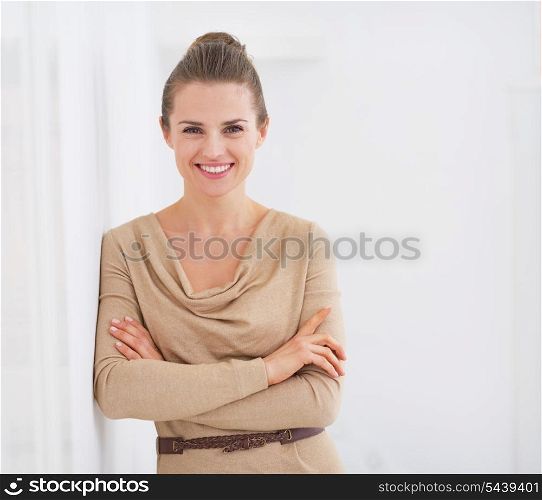 Portrait of happy young housewife