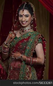 Portrait of happy young Indian bride