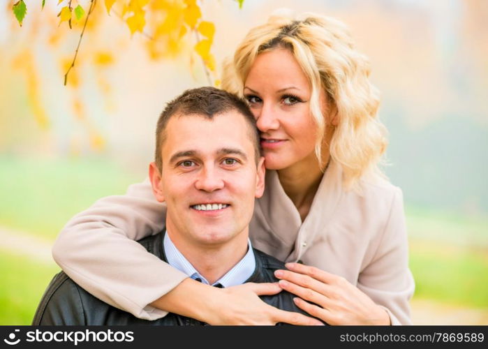 portrait of happy young love couple on nature