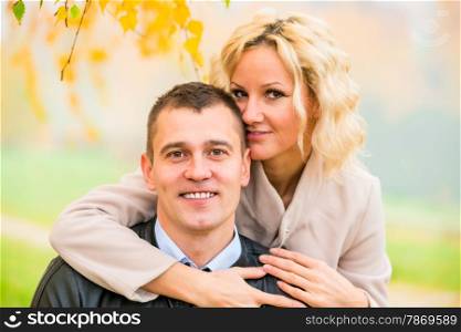 portrait of happy young love couple on nature