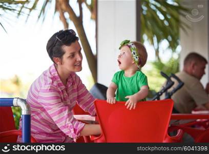 portrait of happy young mother and baby while have fun