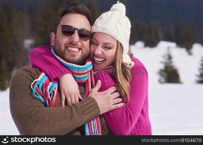 portrait of happy young romantic tourist couple outdoor in nature at winter vacation