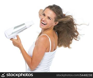 Portrait of happy young woman blow-dry