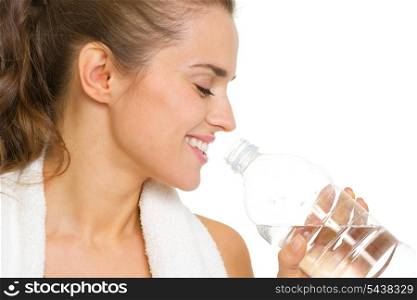 Portrait of happy young woman drinking water