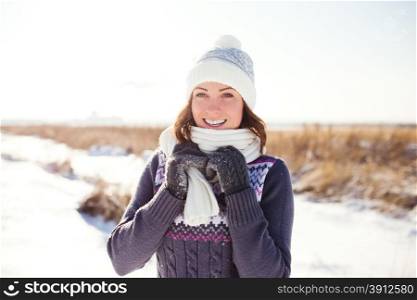 Portrait of happy young woman have fun at beautiful sunny winter day