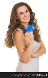 Portrait of happy young woman holding credit card