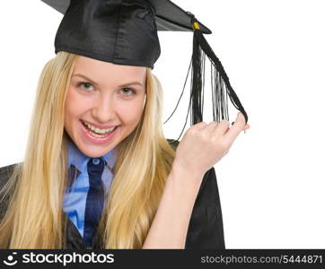 Portrait of happy young woman in graduation gown