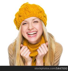 Portrait of happy young woman in hat and scarf