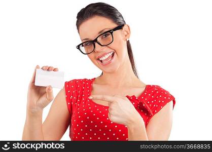 Portrait of happy young woman in red dress showing bussiness card and smiling