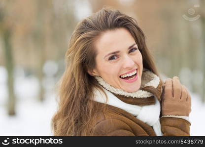 Portrait of happy young woman in winter outdoors