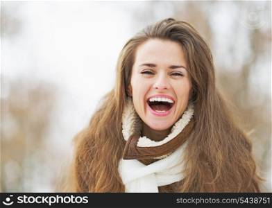 Portrait of happy young woman in winter outdoors