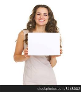 Portrait of happy young woman showing blank paper