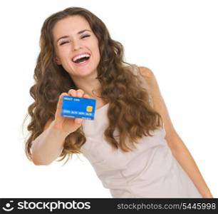 Portrait of happy young woman showing credit card