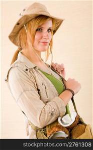 Portrait of happy young woman with safari hat