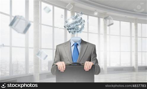 Portrait of headless businessman. Businessman in modern interior with cube instead of head