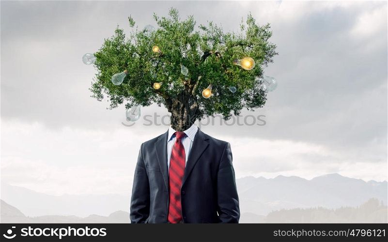 Portrait of headless guy. Man with book in hand and tree instead of head