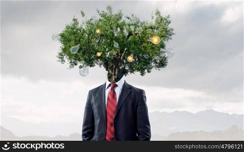 Portrait of headless guy. Man with book in hand and tree instead of head