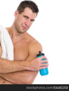 Portrait of healthy muscular man with towel and water of bottle